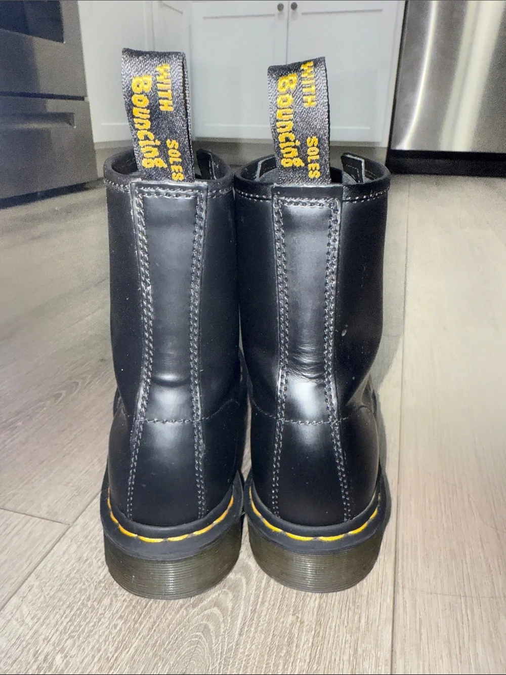 Dr. Martens Black Leather 8-Eye Lace-Up Boots with Yellow Stitching